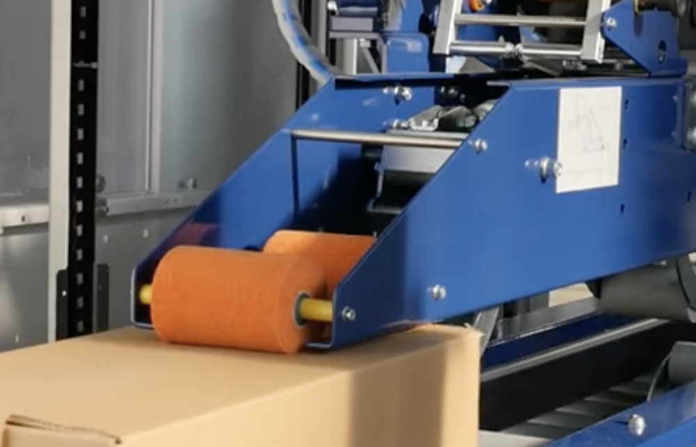 全自动牛皮纸封箱机-湿水牛皮纸切割机-封箱机修理